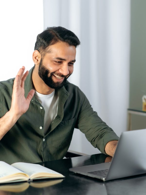 pleasant-friendly-indian-guy-manager-or-financial-consultant-communicates-with-colleagues-on-a.jpg